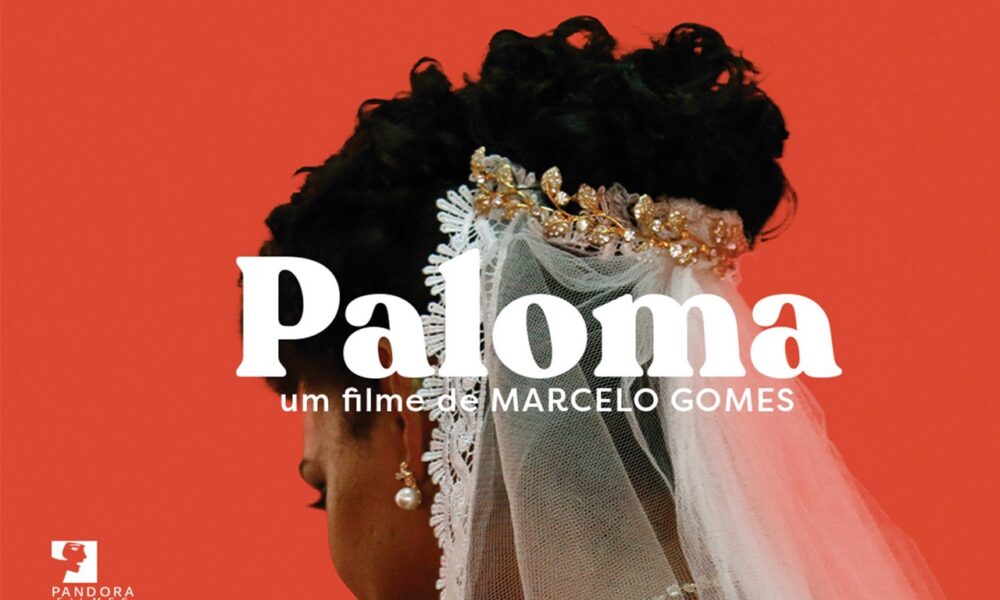 Cartaz do filme "Paloma", de Marcelo Gomes. Mostra o perfil de uma mulher de pele morena, penteado alto e usando um véu de noiva com uma tiara dourada, sobre um fundo vermelho. O título "Paloma" está centralizado em letras brancas grandes, com a frase "um filme de Marcelo Gomes" logo abaixo em letras menores.